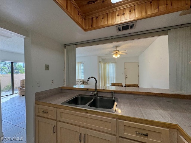 1069 Villa Dr Unit B103, Labelle, FL 33935 - kitchen featuring ceiling fan, light countertops, and light tile patterned floors