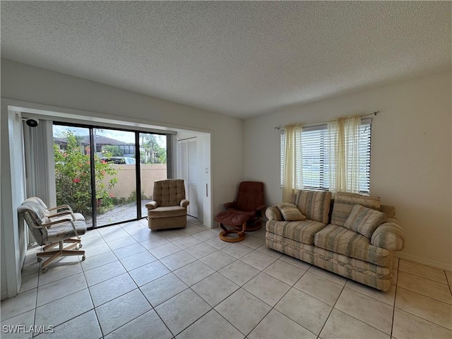 1069 Villa Dr Unit B103, Labelle, FL 33935 - living room with light tile patterned floors and a textured ceiling