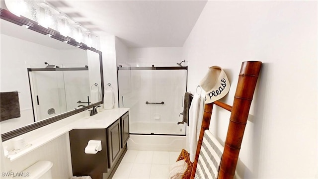 2115 Arielle Dr Unit 2602, Naples, FL 34109 - bathroom with vanity, combined bath / shower with glass door, and tile patterned floors