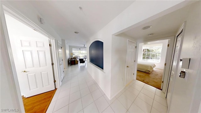 2115 Arielle Dr Unit 2602, Naples, FL 34109 - hallway featuring light tile patterned flooring and light colored carpet