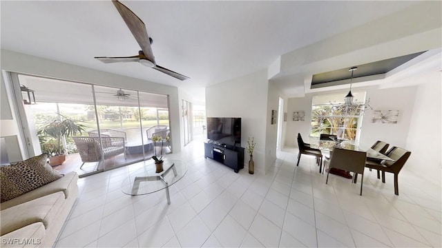 2115 Arielle Dr Unit 2602, Naples, FL 34109 - living area with light tile patterned floors, ceiling fan, and a chandelier
