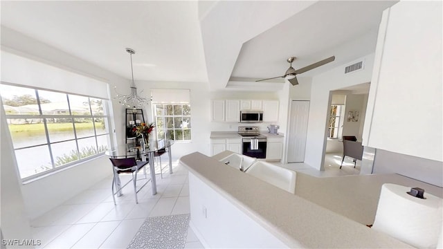 2115 Arielle Dr Unit 2602, Naples, FL 34109 - living room with a chandelier, a ceiling fan, and light tile patterned flooring