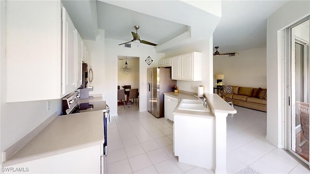 2115 Arielle Dr Unit 2602, Naples, FL 34109 - kitchen with stainless steel appliances, a peninsula, ceiling fan, white cabinetry, and light countertops