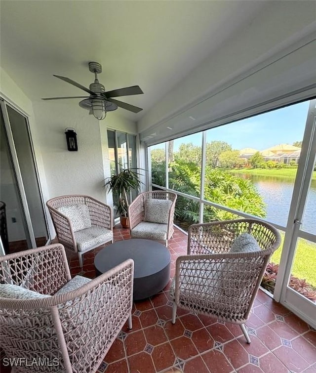 2115 Arielle Dr Unit 2602, Naples, FL 34109 - sunroom / solarium featuring healthy amount of natural light, a water view, and ceiling fan