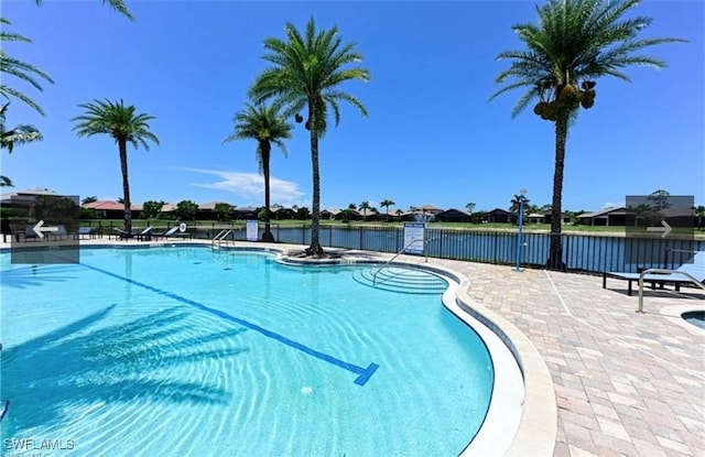 23056 Sanabria Loop, Bonita Springs, FL 34135 - community pool featuring a patio area and a water view