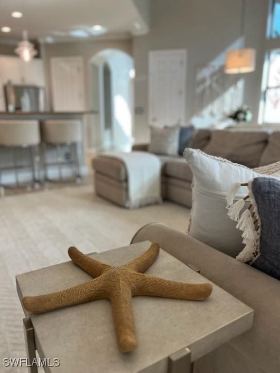 23056 Sanabria Loop, Bonita Springs, FL 34135 - carpeted living area with arched walkways and recessed lighting