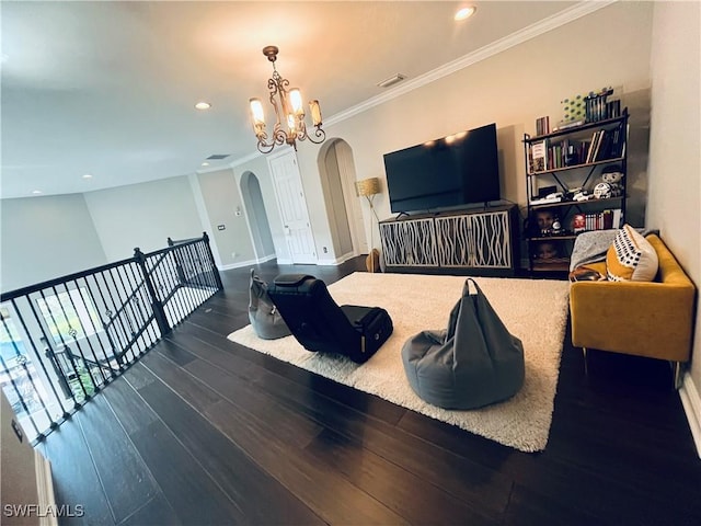 23056 Sanabria Loop, Bonita Springs, FL 34135 - living area with arched walkways, wood finished floors, a chandelier, crown molding, and recessed lighting
