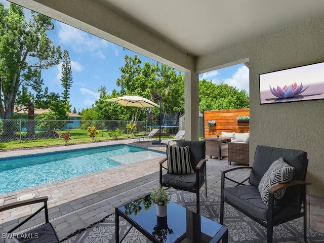 446 SW 19th Ter, Cape Coral, FL 33991 - view of pool with a patio area, an outdoor hangout area, a fenced backyard, and a trampoline