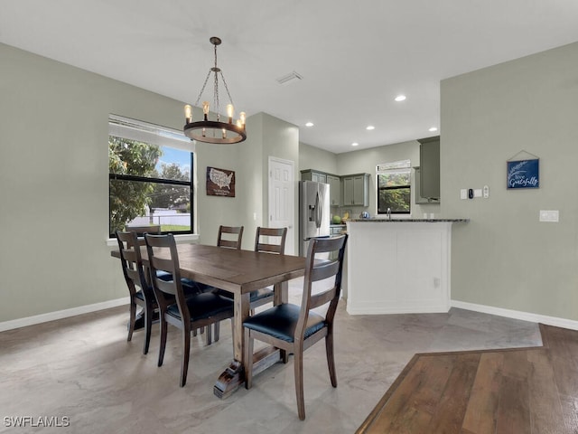 446 SW 19th Ter, Cape Coral, FL 33991 - dining room featuring a chandelier, plenty of natural light, and recessed lighting