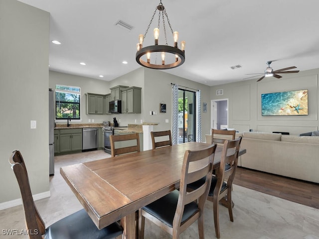 446 SW 19th Ter, Cape Coral, FL 33991 - dining space with a chandelier, ceiling fan, and recessed lighting