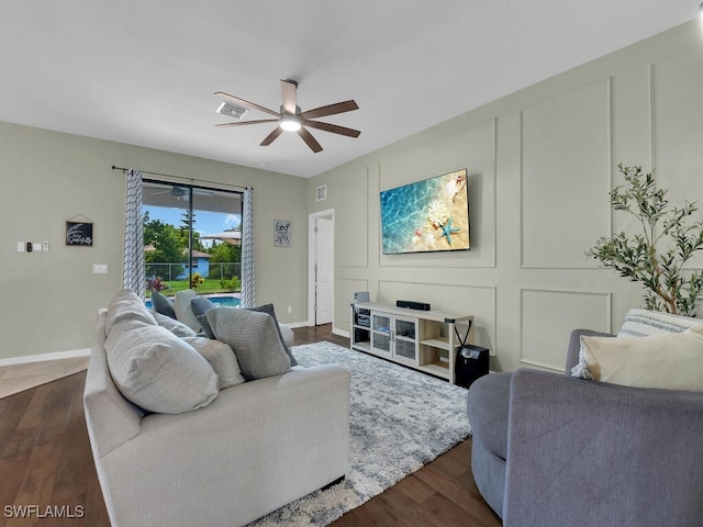 446 SW 19th Ter, Cape Coral, FL 33991 - living area with ceiling fan, dark wood-style floors, and a decorative wall