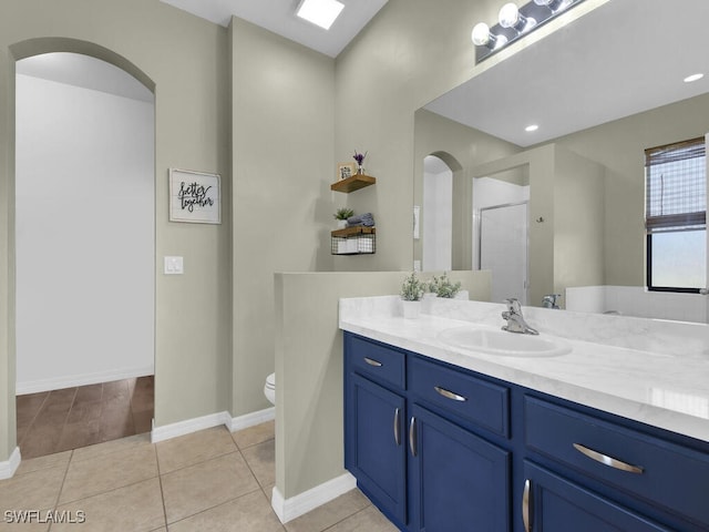 446 SW 19th Ter, Cape Coral, FL 33991 - full bathroom with vanity, an enclosed shower, and tile patterned flooring