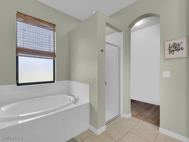 446 SW 19th Ter, Cape Coral, FL 33991 - full bath with a garden tub, a shower stall, and tile patterned flooring
