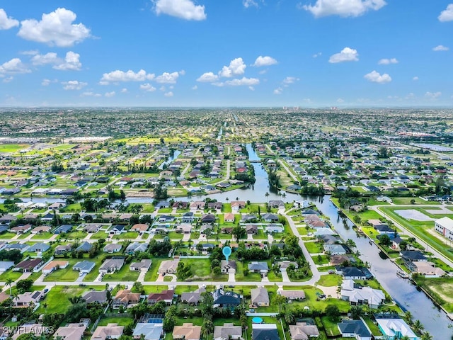 446 SW 19th Ter, Cape Coral, FL 33991 - aerial overview of property's location featuring nearby suburban area and a nearby body of water