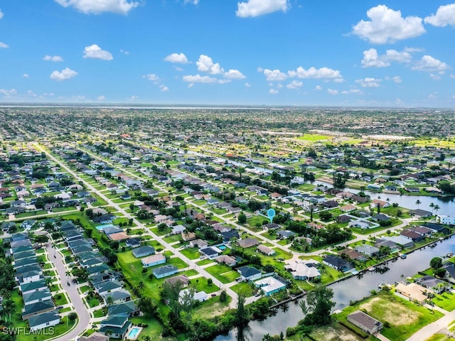 446 SW 19th Ter, Cape Coral, FL 33991 - aerial overview of property's location featuring nearby suburban area and a large body of water