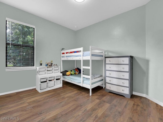 446 SW 19th Ter, Cape Coral, FL 33991 - bedroom featuring hardwood / wood-style floors and baseboards