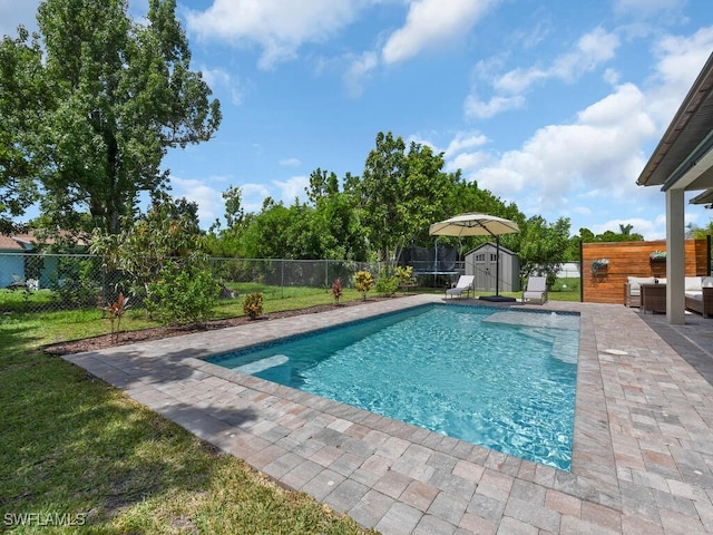 446 SW 19th Ter, Cape Coral, FL 33991 - view of pool with a shed, outdoor lounge area, a patio area, and a fenced backyard