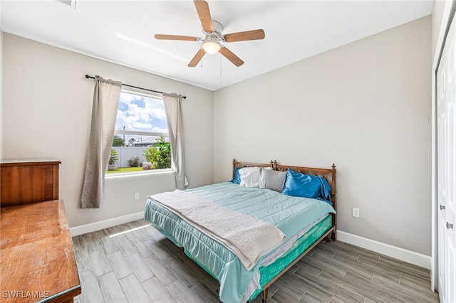 2909 NW 24th Ave, Cape Coral, FL 33993 - bedroom with wood finish floors and a ceiling fan