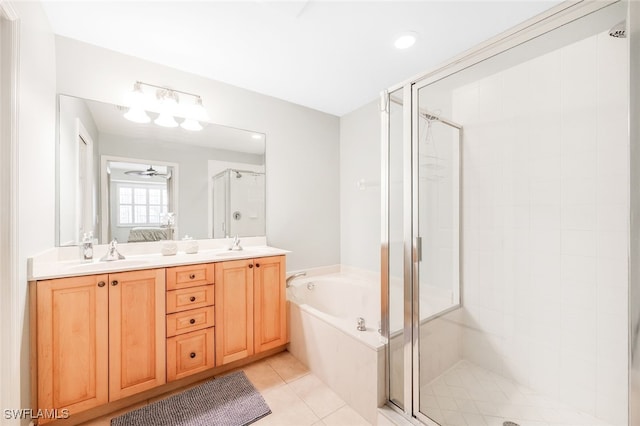 1128 Manor Lake Dr Unit G103, Naples, FL 34110 - bathroom featuring a stall shower, a bath, tile patterned flooring, double vanity, and connected bathroom