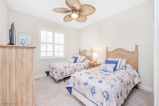 1128 Manor Lake Dr Unit G103, Naples, FL 34110 - carpeted bedroom with baseboards and a ceiling fan