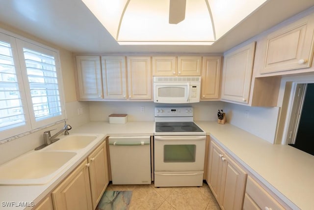 325 Charlemagne Blvd Unit C204, Naples, FL 34112 - kitchen featuring white appliances, light countertops, and light tile patterned floors