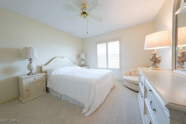 325 Charlemagne Blvd Unit C204, Naples, FL 34112 - bedroom featuring light carpet and ceiling fan