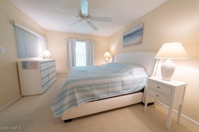 325 Charlemagne Blvd Unit C204, Naples, FL 34112 - bedroom with light carpet, a ceiling fan, and a textured ceiling