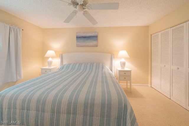325 Charlemagne Blvd Unit C204, Naples, FL 34112 - bedroom featuring carpet flooring, a closet, a textured ceiling, and a ceiling fan