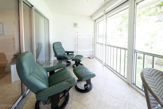 325 Charlemagne Blvd Unit C204, Naples, FL 34112 - sunroom featuring tile patterned flooring