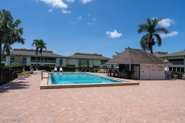 325 Charlemagne Blvd Unit C204, Naples, FL 34112 - community pool featuring a patio area