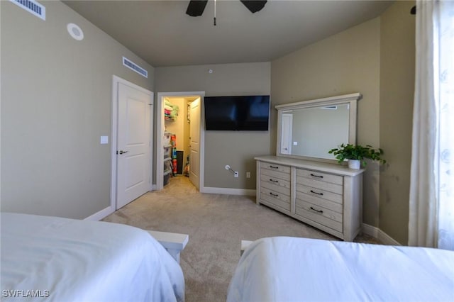 4182 Bay Beach Ln Unit 746, Fort Myers Beach, FL 33931 - bedroom with light carpet, a spacious closet, and a ceiling fan