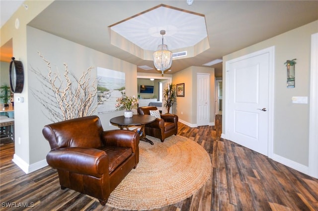 4182 Bay Beach Ln Unit 746, Fort Myers Beach, FL 33931 - sitting room featuring a chandelier, wood finished floors, and a raised ceiling
