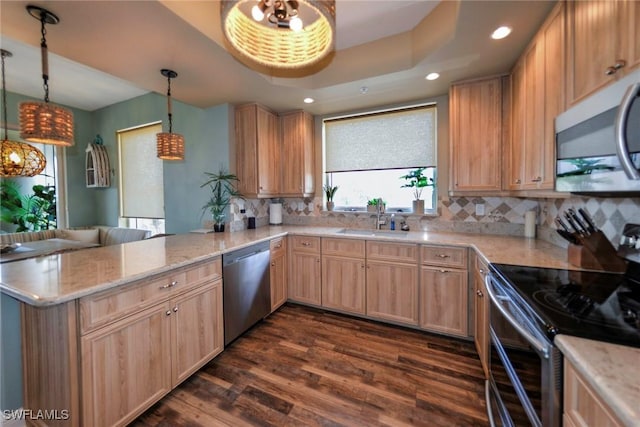 4182 Bay Beach Ln Unit 746, Fort Myers Beach, FL 33931 - kitchen with appliances with stainless steel finishes, a peninsula, light brown cabinetry, dark wood finished floors, and recessed lighting