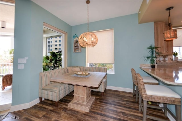 4182 Bay Beach Ln Unit 746, Fort Myers Beach, FL 33931 - dining room with wood finished floors, breakfast area, and a chandelier