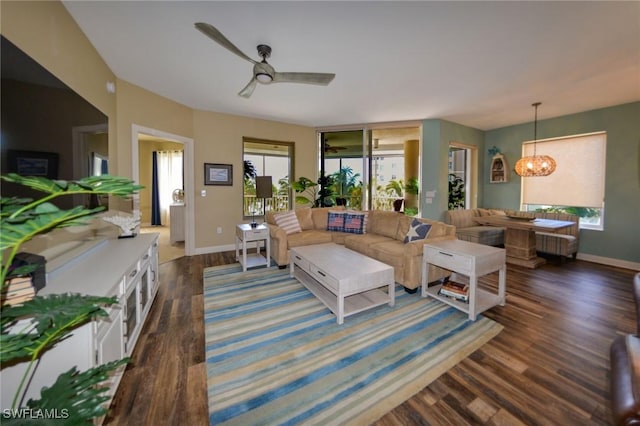 4182 Bay Beach Ln Unit 746, Fort Myers Beach, FL 33931 - living room with a chandelier, dark wood-type flooring, ceiling fan, and radiator