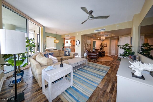 4182 Bay Beach Ln Unit 746, Fort Myers Beach, FL 33931 - living area with ceiling fan, wood finished floors, and a chandelier