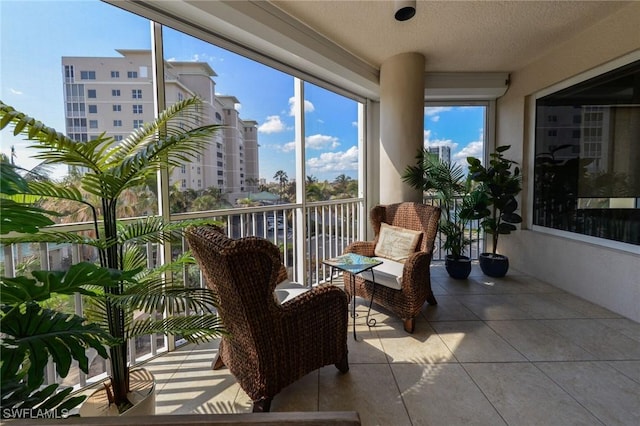 4182 Bay Beach Ln Unit 746, Fort Myers Beach, FL 33931 - sunroom / solarium featuring a textured ceiling and tile patterned floors