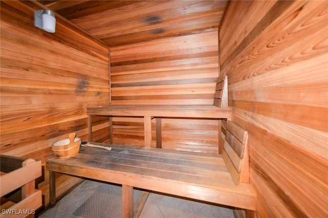 4182 Bay Beach Ln Unit 746, Fort Myers Beach, FL 33931 - relaxing sauna with wooden ceiling, wooden walls, and tile patterned floors
