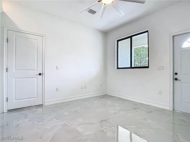 3705 8th St SW, Lehigh Acres, FL 33976 - spare room with ceiling fan and light marble finish floors