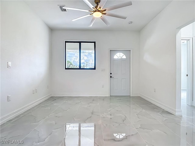 3705 8th St SW, Lehigh Acres, FL 33976 - foyer featuring light marble finish flooring and a ceiling fan