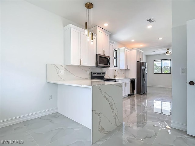 3705 8th St SW, Lehigh Acres, FL 33976 - kitchen with stainless steel appliances, light marble finish floors, recessed lighting, tasteful backsplash, and light stone counters