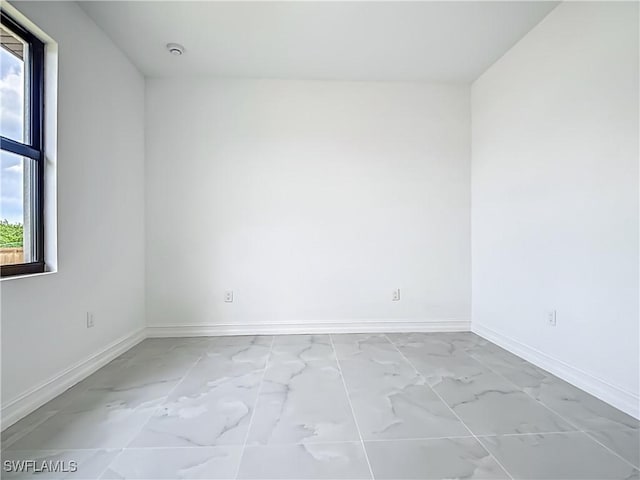 3705 8th St SW, Lehigh Acres, FL 33976 - unfurnished room featuring light marble finish floors