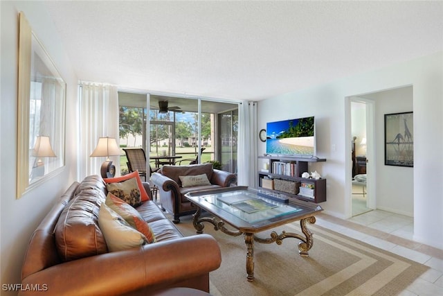 1086 Forest Lakes Dr Unit 9106, Naples, FL 34105 - tiled living room featuring a wall of windows