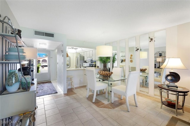 1086 Forest Lakes Dr Unit 9106, Naples, FL 34105 - dining area with light tile patterned floors