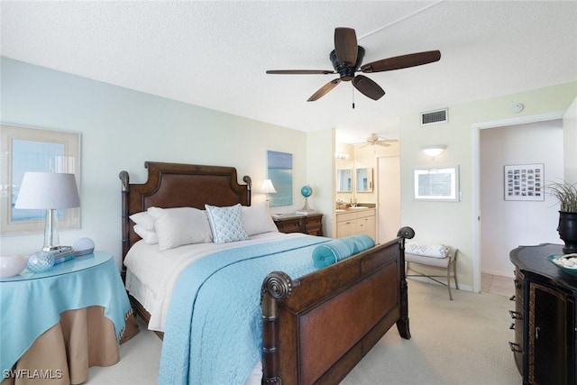 1086 Forest Lakes Dr Unit 9106, Naples, FL 34105 - bedroom with light carpet, ensuite bathroom, and ceiling fan
