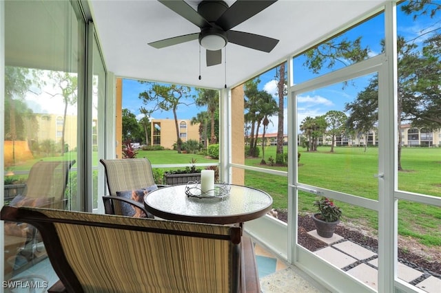 1086 Forest Lakes Dr Unit 9106, Naples, FL 34105 - sunroom with plenty of natural light and a ceiling fan