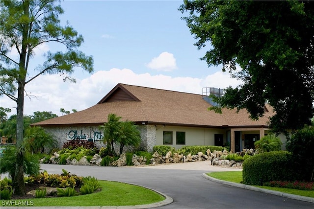 34 Glades Blvd Unit 1461, Naples, FL 34112 - view of front facade featuring stone siding