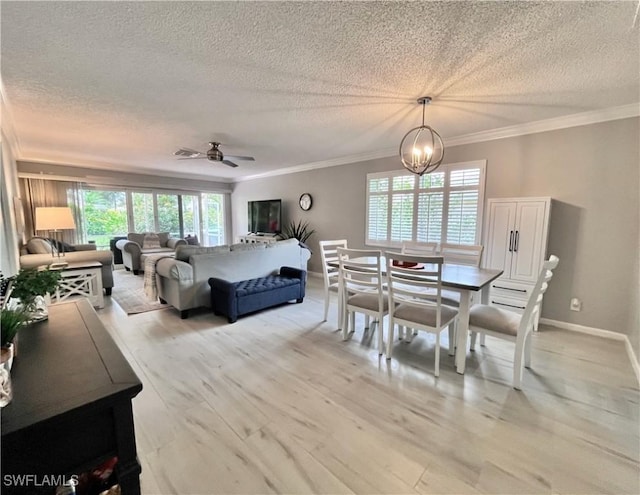 34 Glades Blvd Unit 1461, Naples, FL 34112 - dining room with a textured ceiling, plenty of natural light, ornamental molding, light wood-style flooring, and ceiling fan