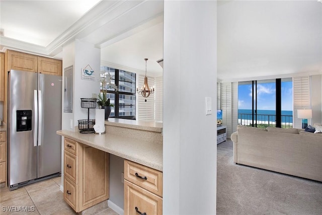 440 Seaview Ct Unit 1106, Marco Island, FL 34145 - kitchen with stainless steel fridge with ice dispenser, light countertops, a water view, light brown cabinetry, and open floor plan