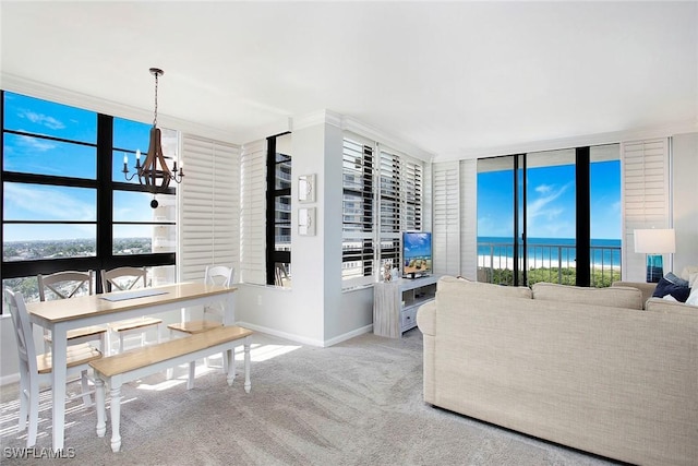 440 Seaview Ct Unit 1106, Marco Island, FL 34145 - living room with a chandelier, carpet floors, healthy amount of natural light, and floor to ceiling windows